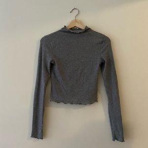 Lettuce hem mock neck sweater
